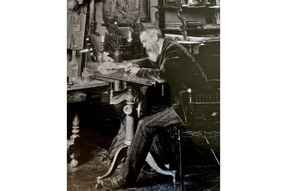 Thomas Moran, in the latter part of the 1870s, working at the etching table in the Newark studio that served as his base during most of that decade. This was a period of growing popularity for the medium, and Moran acquired his own etching press at this time. After 1878, many of Moran's major etchings were derived from his impressions of East Hampton. (Archival photo, East Hampton Library)